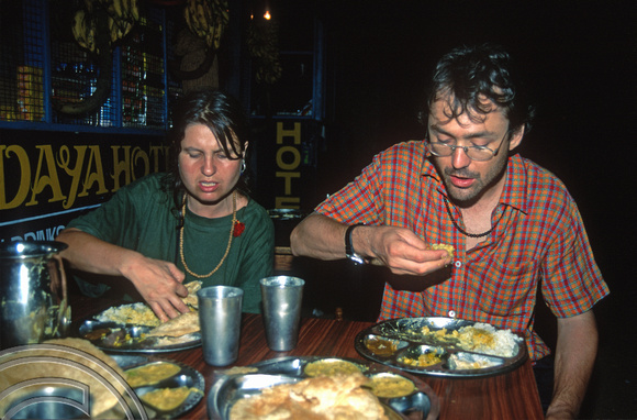 T6357. Matt and Lihn eating a thali. Varkala. Kerala. India. December.1997