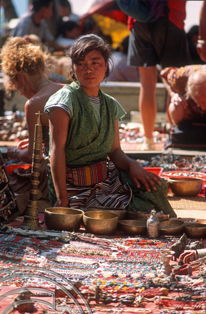 T4489. Tibetan girl selling beads at the Flea market. Anjuna. Goa. India. December 1993.
