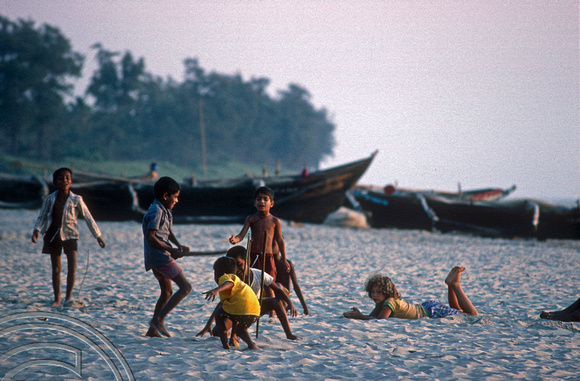 T4503. Kids playing cricket on the beach. Goa. India. December 1993.
