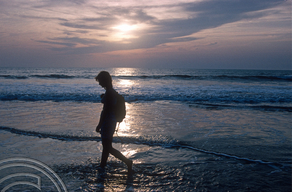 T4555. Lynn walking on the beach. Arambol. Goa. India. December 1993.