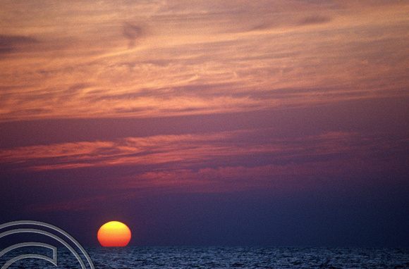 T4564. New Years Eve sunset on the beach. Arambol. Goa. India. 31st December 1993.