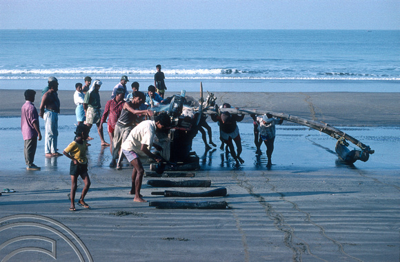 T4576. Bringing a fishing boat ashore. Arambol. Goa. India. January 1994.