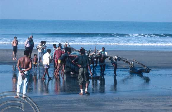 T4577. Bringing a fishing boat ashore. Arambol. Goa. India. January 1994.
