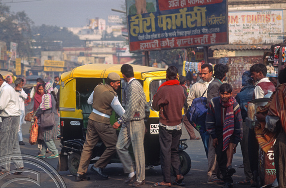 T4593. Police impound a rickshaw. Paharganj. Old Delhi. India. January 1994.