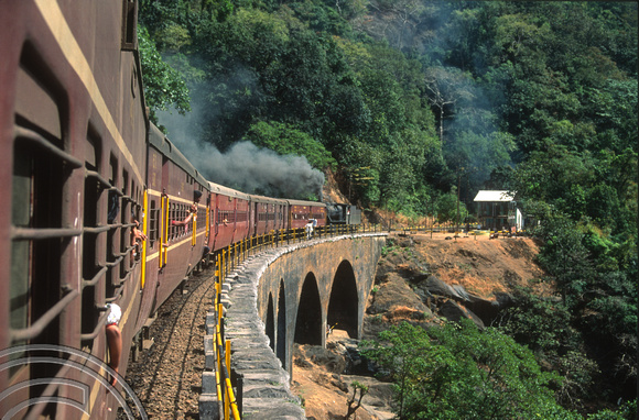 T03084. Vasco-Bangalore train banked by steam engine 30154. Dudhsagar. Goa. India. December 1991.