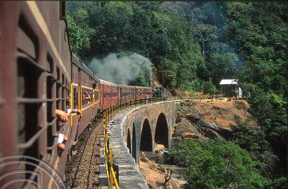 T03085. Vasco-Bangalore train banked by steam engine 30154. Dudhsagar. Goa. India. December 1991.