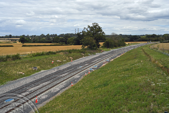 DG399913. E-W rail tracklaying seen from Queen Catherine Rd. Steeple Claydon. 1.8.2023.