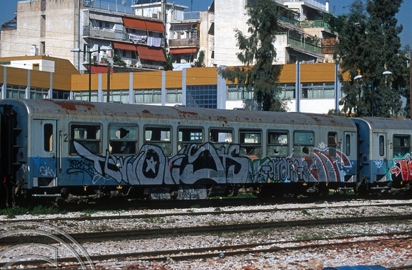 18014. Condemned metre gauge coaches. Peloponnese station. Athens. Greece. February 2004