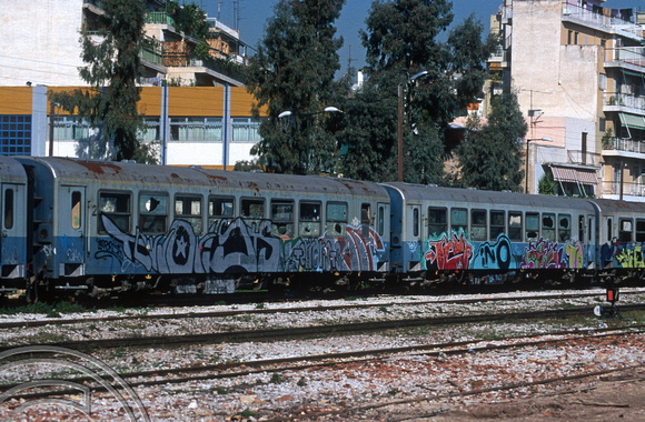 18015. Condemned metre gauge coaches. Peloponnese station. Athens. Greece. February 2004