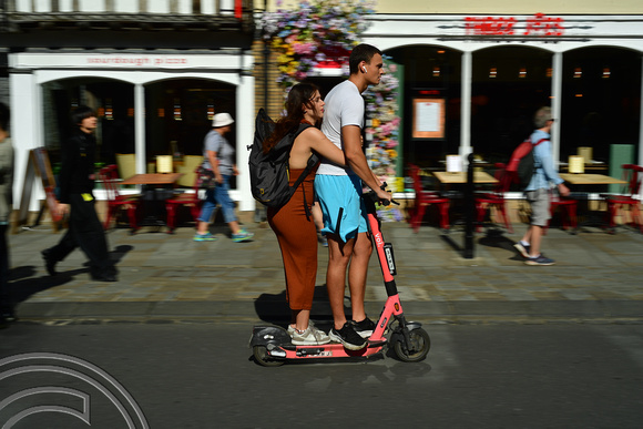 DG401561. Couple on an e-scooter. Cambridge. 4.9.2023.