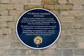 DG350638. Station plaque. Wickham Market. 9.6.2021.
