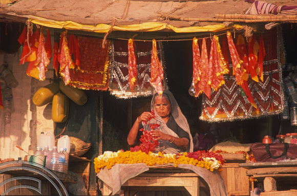 T6881. Flower seller at the ghats. Varanasi. Uttar Pradesh. India. February 1998