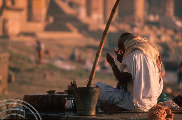 T6849. Priest at the ghats. Varanasi. Uttar Pradesh. India. February 1998. jpg