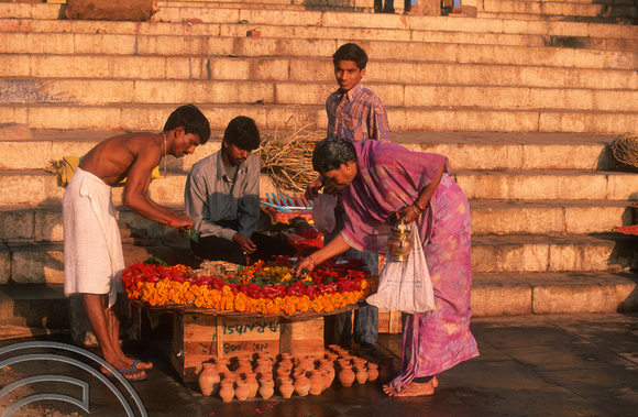 T6850. Buying flowers at the ghats. Varanasi. Uttar Pradesh. India. February 1998. jpg