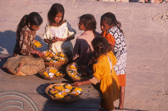 T6791. Girls selling flowers at the ghats. Varanasi. Uttar Pradesh. India. February 1998