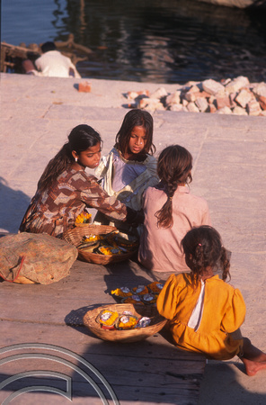 T6792. Girls selling flowers at the ghats. Varanasi. Uttar Pradesh. India. February 1998