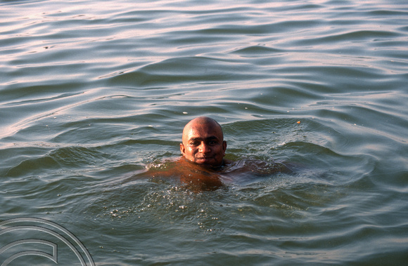 T6807.Man bathing at the Ghats at dawn. Varanasi. Uttar Pradesh. India. February 1998