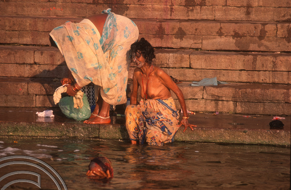 T6810. Woman bathing at the Ghats at dawn. Varanasi. Uttar Pradesh. India. February 1998