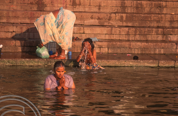 T6811. Women bathing at the Ghats at dawn. Varanasi. Uttar Pradesh. India. February 1998
