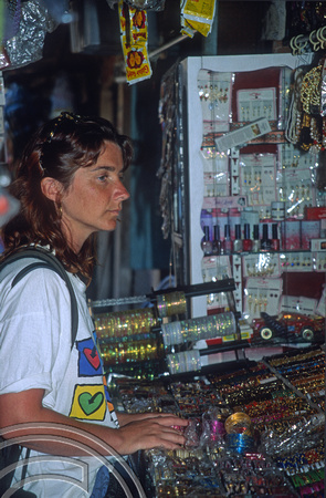 T5812. Lynn buying bangles in the market. Mysore. Karnataka. India. January 1996