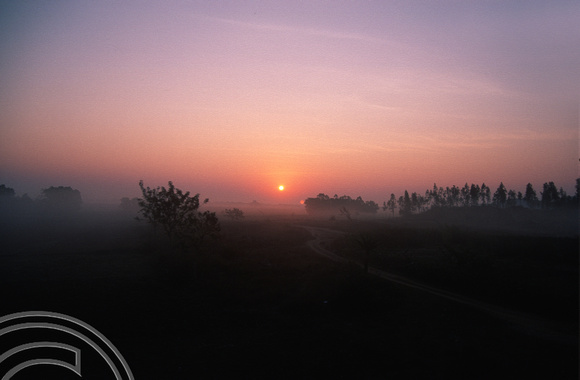 T6685. Sunrise from the train to Puri. Orissa. India. February 1998