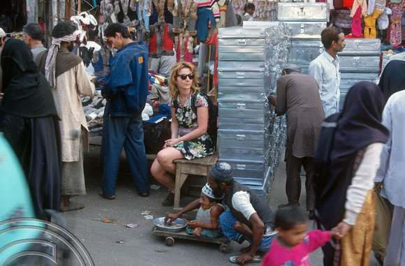 T04197. Lynn and crippled beggar. Chandni Chowk. Old Delhi. India. December 1993