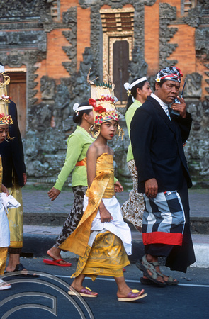 T015937. Girl in a procession. Ubud. Bali. Indonesia. 19th September 2003