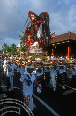 T015957. Carrying the God Dewi Durga in a a procession. Ubud. Bali. Indonesia. 19th September 2003