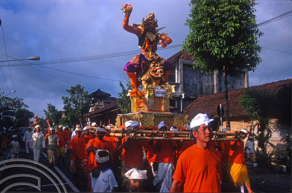 T015959. Carrying the God Dewa Rudra in a a procession. Ubud. Bali. Indonesia. 19th September 2003