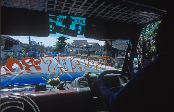 T015979. Drivers eye view from a Bemo bound for Ubud. Batubulan. Bali. Indonesia. 20th September 2003