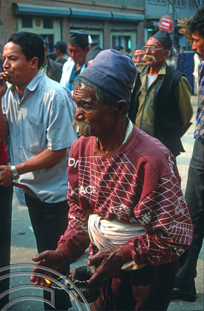 T3376. Old man with oil lamp. Kathmandu. Nepal. 1992