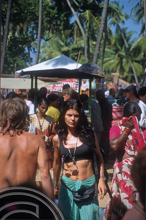 T5584. People at the flea market. Anjuna. Goa. India. December 1995