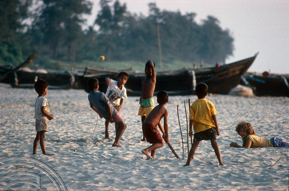 T4502. Kids playing cricket on the beach. Goa. India. December 1993