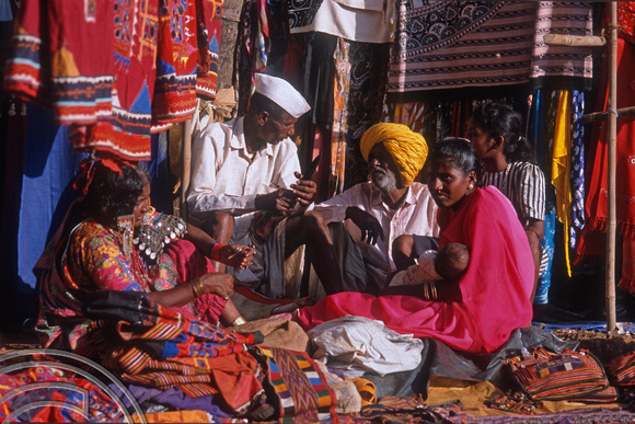 T9438. Family selling bags. Flea market Anjuna. Goa. India. 2nd February 2000