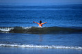 T5923. Lynn playing in the waves. Arambol. Goa. India. January 1996.