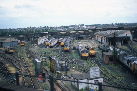 06742. View of the depot from a passing train. Stewarts Lane. June 97