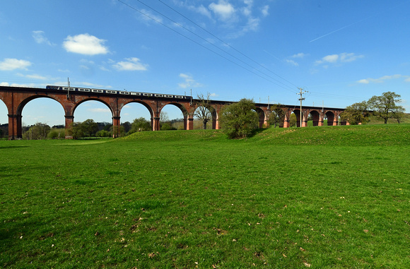 DG320994. Northern Class 319 crosses the Holmes Chapel viaduct. 10.4.19