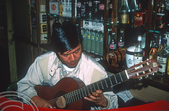 T6993. Puran Gongba in his bar, Joey's Pub. Darjeeling. West Bengal. India. April.1998.