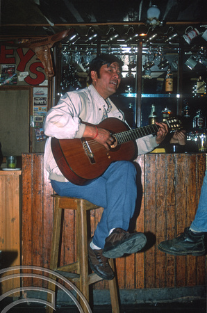 T6997. Puran Gongba in his bar, Joey's Pub. Darjeeling. West Bengal. India. April.1998.