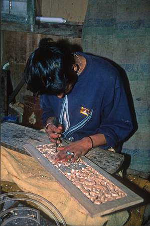 T6956. Wood carver at the Tibetan refugee centre. Darjeeling. West Bengal. India. April.1998.