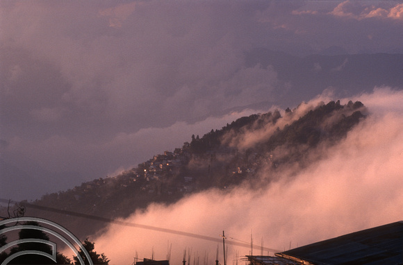 T6967. Clouds come in across the town. Darjeeling. West Bengal. India. April.1998.