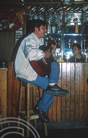 T6996. Puran Gongba in his bar, Joey's Pub. Darjeeling. West Bengal. India. April.1998.