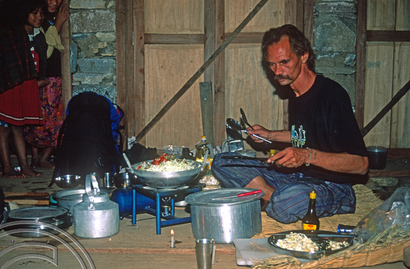 T7094.  Axel cooking the evening meal. Gorkha district. Nepal. April.1998.