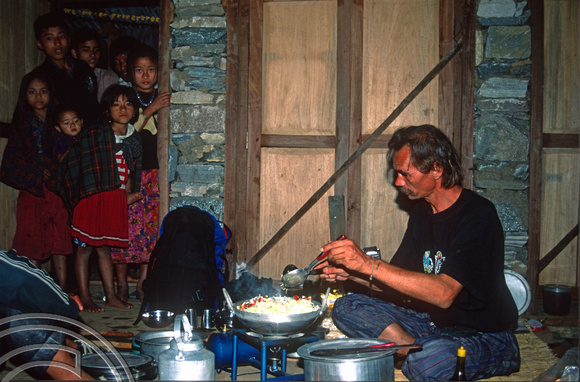 T7095.  Axel cooking the evening meal. Gorkha district. Nepal. April.1998.