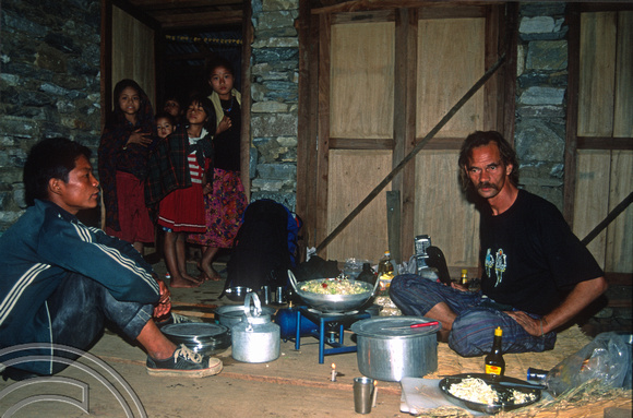 T7096.  Axel cooking the evening meal. Gorkha district. Nepal. April.1998.
