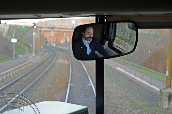 DG47841. The driver of a CFL service from Luxembourg to Trier reflected in his mirror. Germany. 1.4.10.