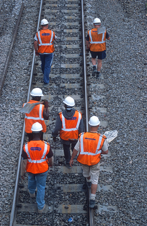 12936. Track workers walking back to the worksite after lunch. Slough. 25.08.2003