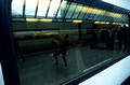 13049. Acrobats reflected in the windows of a Eurostar. Waterloo International. 27.09.2003