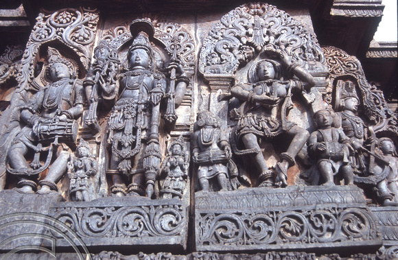 T03124. Statues on the Hoysaleswara temple. Halebid. Karnataka. India. December 1991