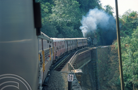 T03078. Vasco-Bangalore train banked by a steam engine 30154. Dudhsagar. Goa. India. December 1991.